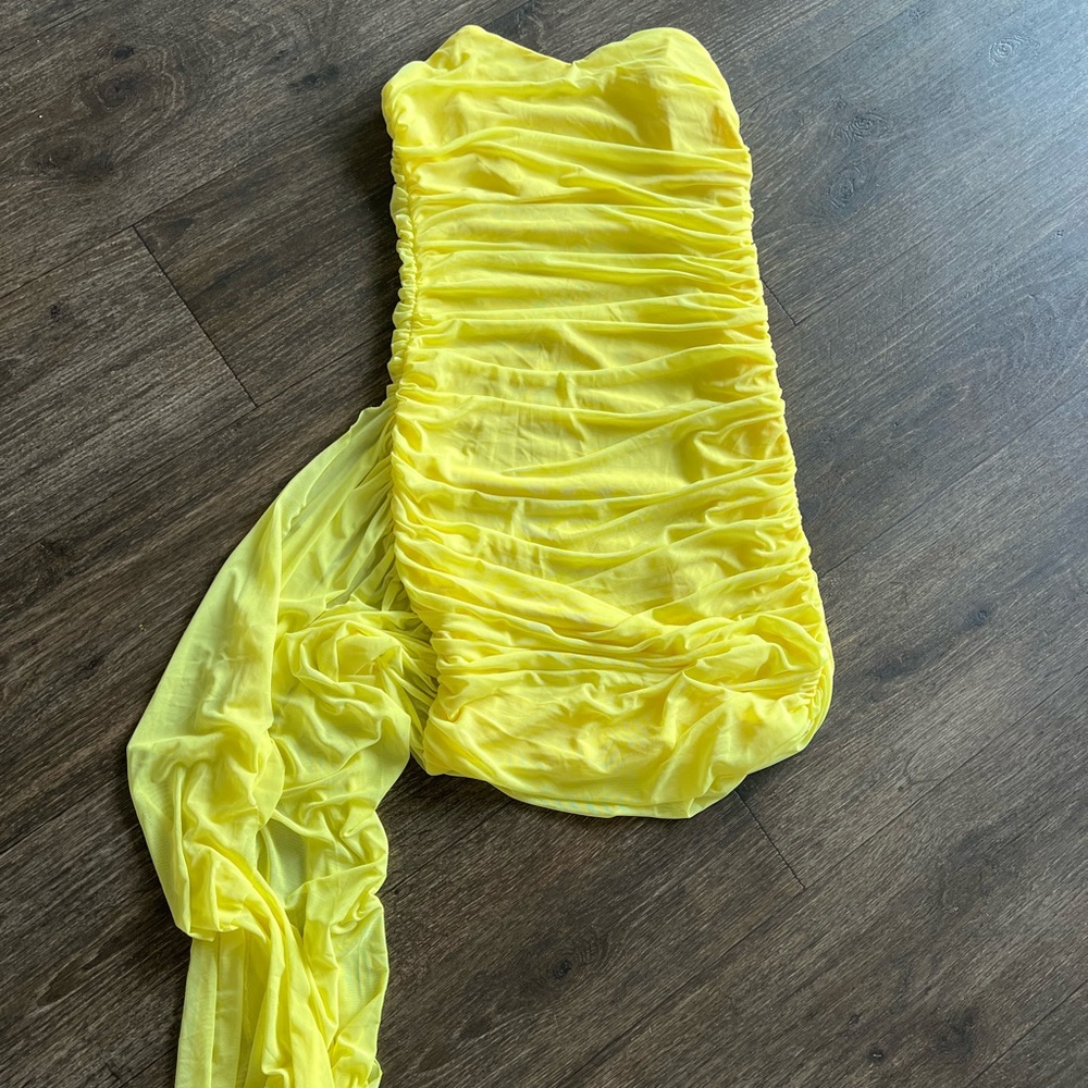 Yellow body con dress with side train